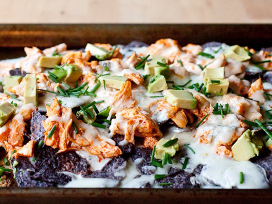 Layered buffalo chicken nachos with creamy gorgonzola sauce